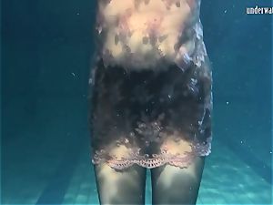 Lozhkova in observe through shorts in the pool